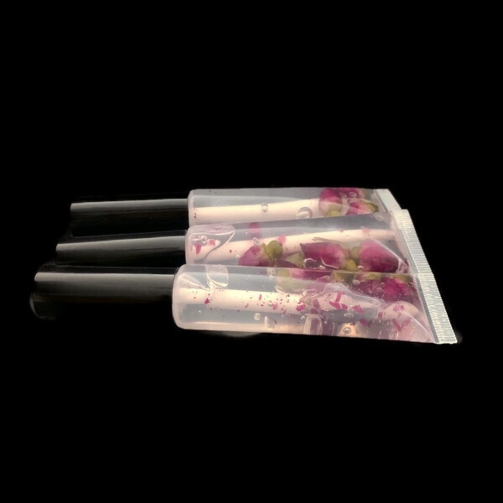 For all 3 /$15  Essentials Lip glosses with rose flower buds - Picture 3 of 8